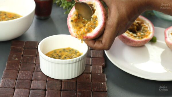 Extracting pulp from fresh passion fruits.