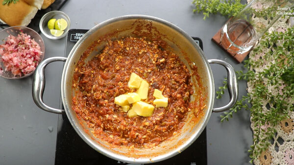 adding the butter paneer-pav-bhaji